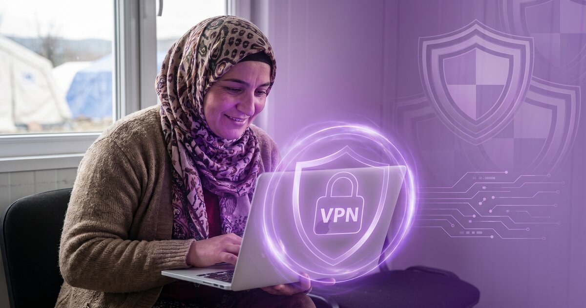 Refugee with laptop using VPN protection shield for safety and family connections