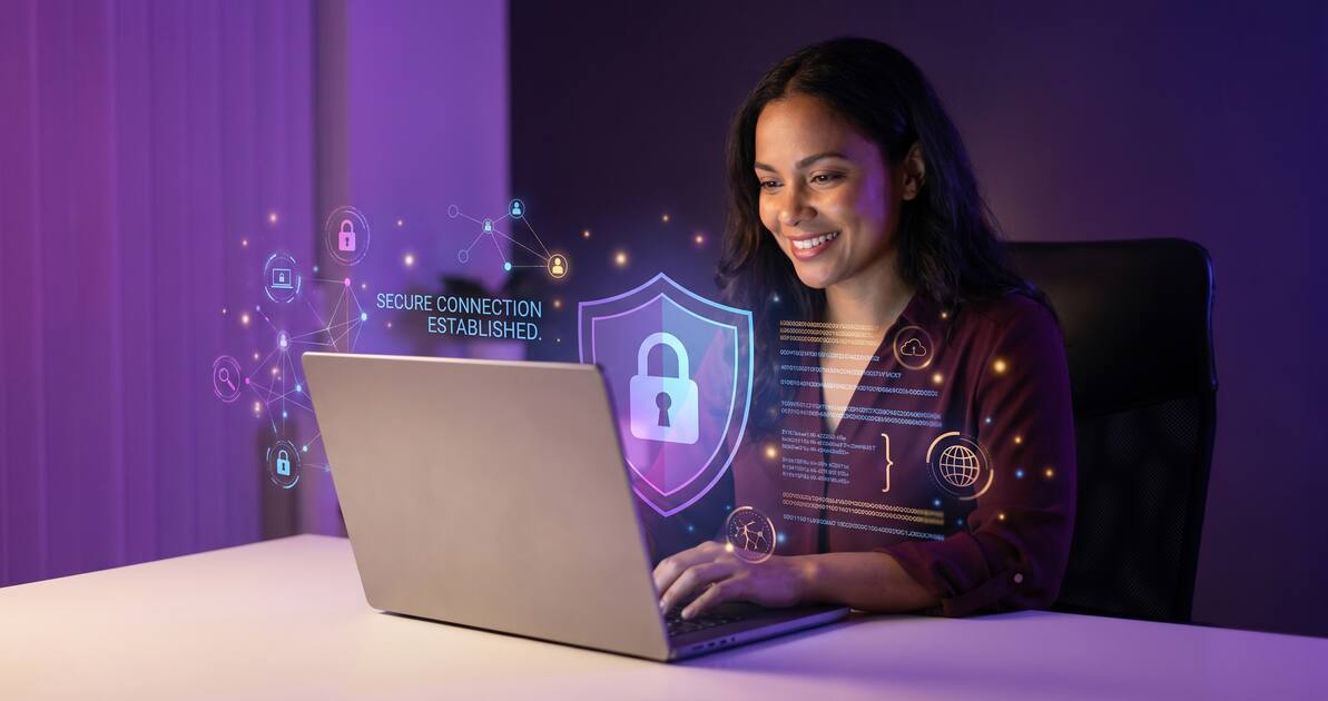 Sex worker using laptop with VPN shield protection for digital safety